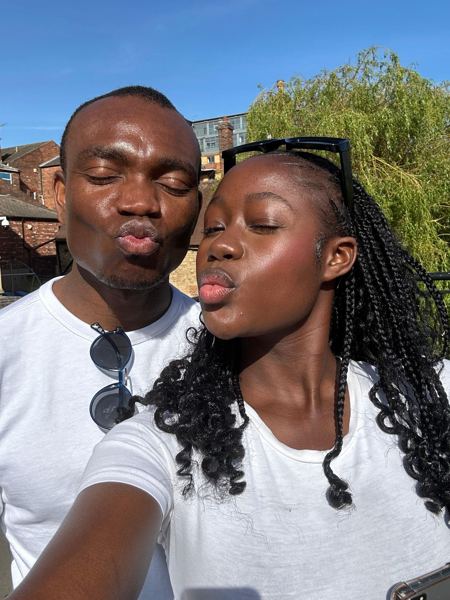A sunny selfie, Makanaka kissing Davidson's cheek
