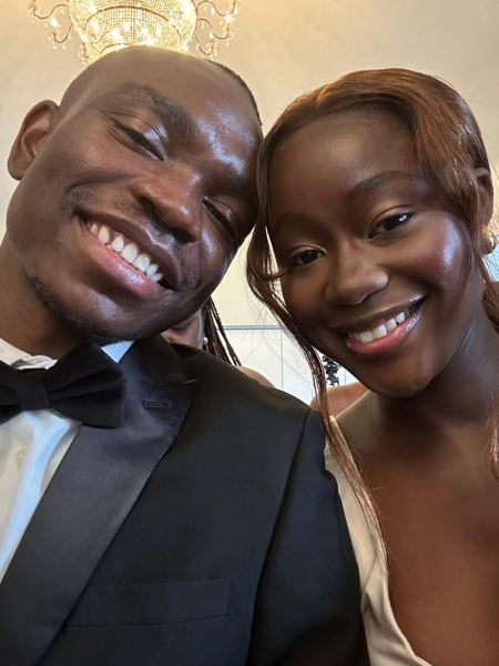 Davidson in a tuxedo with Makanaka at an evening event